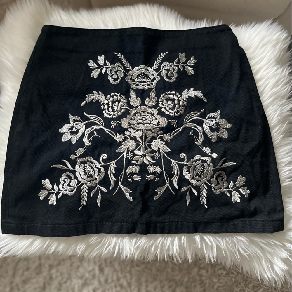 Black denim skirt with floral embroidery